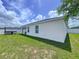 Well-maintained backyard with lush green grass and privacy fence at 1205 Third Ct, Eagle Lake, FL 33839