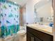 Bathroom featuring single vanity and a decorative shower curtain at 1205 Third Ct, Eagle Lake, FL 33839