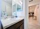 Bathroom featuring single vanity and decorative mirror at 1205 Third Ct, Eagle Lake, FL 33839