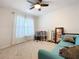 Bright bedroom with a desk and comfortable seating offers an ideal space for work or relaxation at 1205 Third Ct, Eagle Lake, FL 33839