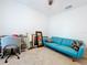 This bedroom features a comfortable seating area, perfect for relaxing or reading at 1205 Third Ct, Eagle Lake, FL 33839