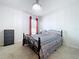 Bedroom featuring neutral carpet, a chandelier, and natural light from the window at 1205 Third Ct, Eagle Lake, FL 33839
