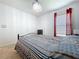 Bedroom featuring neutral carpet, a chandelier, and natural light from the window at 1205 Third Ct, Eagle Lake, FL 33839