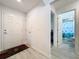 Bright entryway featuring modern flooring and convenient access to the bathroom and bedrooms at 1205 Third Ct, Eagle Lake, FL 33839