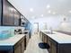 Modern kitchen with stainless steel appliances, dark wood cabinets, and long countertops at 1205 Third Ct, Eagle Lake, FL 33839