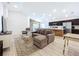 Open-concept living area with modern flooring and views of the kitchen at 1205 Third Ct, Eagle Lake, FL 33839