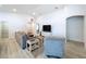 Bright living room with modern flooring and vaulted ceilings at 1205 Third Ct, Eagle Lake, FL 33839
