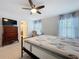 Spacious main bedroom featuring a plush mattress, dresser, and cozy chair for ultimate comfort at 1205 Third Ct, Eagle Lake, FL 33839