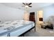Spacious main bedroom with plush mattress, dresser, and seating offering a relaxing retreat at 1205 Third Ct, Eagle Lake, FL 33839