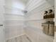 Walk-in pantry features spacious wire shelving, offering ample storage for all your culinary needs at 1205 Third Ct, Eagle Lake, FL 33839