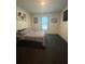 Bedroom featuring twin bed, dark carpet, and window allowing for natural light at 1414 Fox Squirrel Dr, Davenport, FL 33897