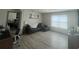 Cozy living room with modern furnishings and ample natural light from the large window at 1414 Fox Squirrel Dr, Davenport, FL 33897