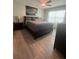 This main bedroom has an ensuite bathroom and is furnished with warm neutral tones and stylish décor at 1414 Fox Squirrel Dr, Davenport, FL 33897