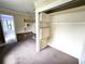 Carpeted closet space with open shelving, adjacent to an open space at 142 Se Ave B, Winter Haven, FL 33880