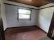 Cozy room with brick floors, wood ceiling trim, and a window letting in natural light at 142 Se Ave B, Winter Haven, FL 33880