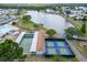 Overhead image featuring a lake, pickleball, and shuffleboard courts within the community at 1575 Longbow Dr, Lakeland, FL 33810