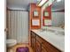 Bathroom featuring a shower with curtain, vanity, sink, mirror, and decor at 1575 Longbow Dr, Lakeland, FL 33810