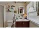 Bathroom featuring a sink, window and decor at 1575 Longbow Dr, Lakeland, FL 33810