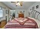 Cozy bedroom featuring a decorative quilt and a view of the closet at 1575 Longbow Dr, Lakeland, FL 33810
