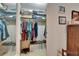 Walk-in closet features hanging storage, shelves, and space for organization at 1575 Longbow Dr, Lakeland, FL 33810