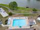 Aerial view of the community pool overlooking the lake at 1575 Longbow Dr, Lakeland, FL 33810