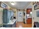 Bright, vintage kitchen with ample storage, decor and an adjacent food preparation area at 1575 Longbow Dr, Lakeland, FL 33810