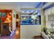 Bright living area with a large aquarium feature and wood flooring at 1575 Longbow Dr, Lakeland, FL 33810
