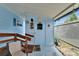 Charming blue porch featuring a door, some decor and lattice fencing for privacy at 1575 Longbow Dr, Lakeland, FL 33810