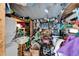 A cluttered shed with a stacked washer and dryer unit and storage at 1575 Longbow Dr, Lakeland, FL 33810