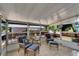 Inviting sunroom with tile flooring, wicker furniture, and views of the outdoors at 1575 Longbow Dr, Lakeland, FL 33810
