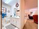 Bathroom featuring spacious vanity with toilet and access to living room at 1600 Alma Ct, Bartow, FL 33830