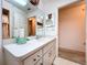 Bathroom featuring large vanity and mirror, with view into a bedroom at 1600 Alma Ct, Bartow, FL 33830