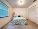 Cozy bedroom featuring a comfortable bed, closet and natural light from the window at 1600 Alma Ct, Bartow, FL 33830
