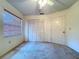 Well-lit bedroom featuring a window, closet, and neutral colored walls at 1600 Alma Ct, Bartow, FL 33830