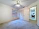 Neutral colored bedroom with a window, closet and view to the hall at 1600 Alma Ct, Bartow, FL 33830
