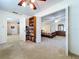 Bright bedroom featuring access to other rooms, comfortable bed, and charming decor at 1600 Alma Ct, Bartow, FL 33830