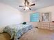 Cozy bedroom with natural light, a bed, and a dresser at 1600 Alma Ct, Bartow, FL 33830
