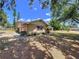 Charming home exterior with well-maintained lawn and landscaping at 1600 Alma Ct, Bartow, FL 33830