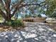 A well-maintained single-story home with a two-car garage and mature trees offers great curb appeal and charm at 1600 Alma Ct, Bartow, FL 33830