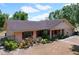 Desirable single-story home featuring shutters, an attached garage, landscaping and a charming entryway at 1600 Alma Ct, Bartow, FL 33830