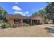 A beautiful single-story home features a landscaped front yard and attached two-car garage with great curb appeal at 1600 Alma Ct, Bartow, FL 33830