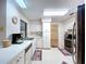This bright kitchen features white cabinets and is connected to the dining area at 1600 Alma Ct, Bartow, FL 33830