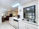Spacious kitchen with updated appliances offering views into the main living area at 1600 Alma Ct, Bartow, FL 33830