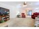 Open living room with plush seating and access to the lanai with sliding glass doors at 1600 Alma Ct, Bartow, FL 33830