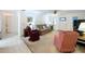 A cozy living room features ample seating and natural light, creating a welcoming and comfortable space at 1600 Alma Ct, Bartow, FL 33830