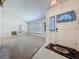 Inviting living room featuring neutral paint, plush carpeting, and a view into adjacent rooms at 1600 Alma Ct, Bartow, FL 33830