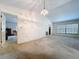 Spacious living area with neutral carpeting, a large window, and view to other rooms at 1600 Alma Ct, Bartow, FL 33830
