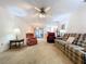 Comfortable living room featuring plush seating, ceiling fan and access to the lanai at 1600 Alma Ct, Bartow, FL 33830