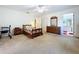Spacious main bedroom with ensuite bathroom featuring a ceiling fan and neutral color palette at 1600 Alma Ct, Bartow, FL 33830