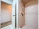 Shower with beige tile at 1600 Alma Ct, Bartow, FL 33830